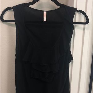 Black sleeveless ruffle front top